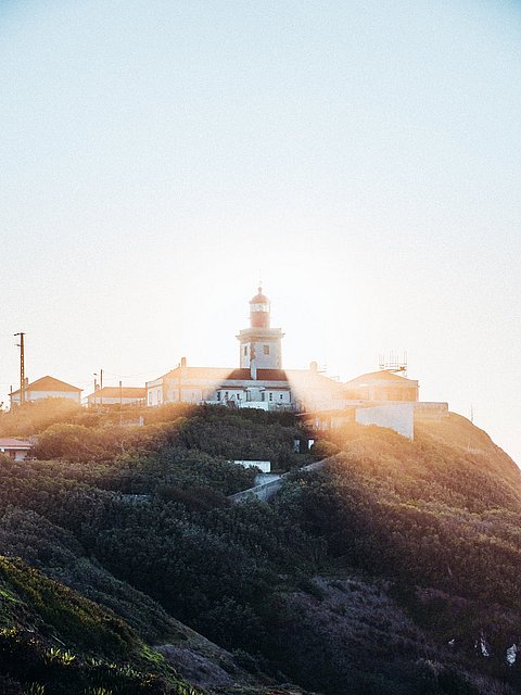 Background image showing a lighthouse